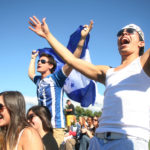 people cheering in a crowd