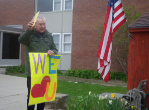 Drive-by birthday party showers love on Fr. Ray at 90