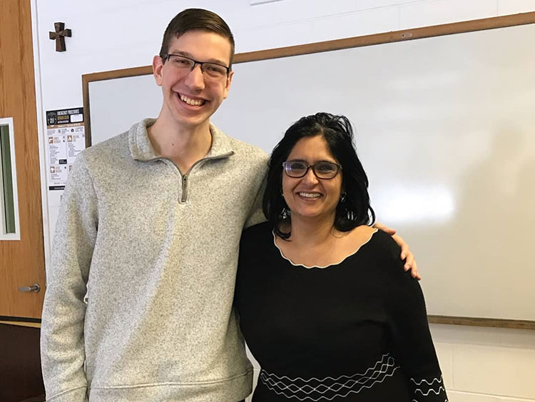 A photo of Shane Coughlin with a professor.