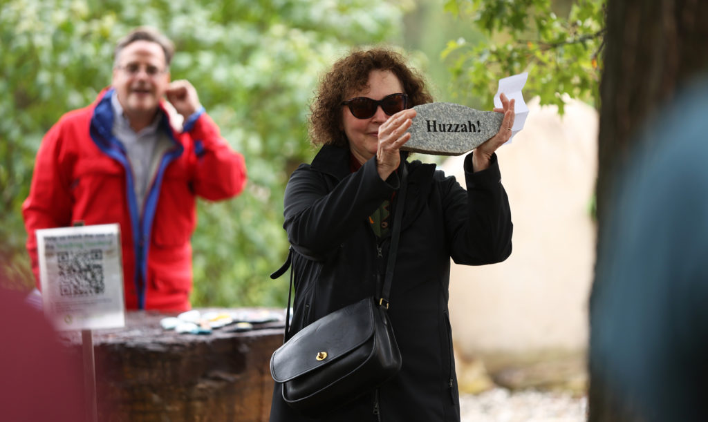 Liz Inness-Brown leads a cheer of 