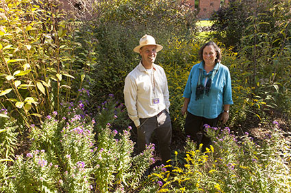 Mark Lubkowitz, left, and Valerie Bang-Jensen, in the Teaching Gardens earlier in their years of collaboration back in 2013. The top image behind the headline shows Mark researching corn with a collaborator a few years ago.