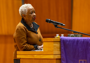 Speaker relates racial violence of history to present times