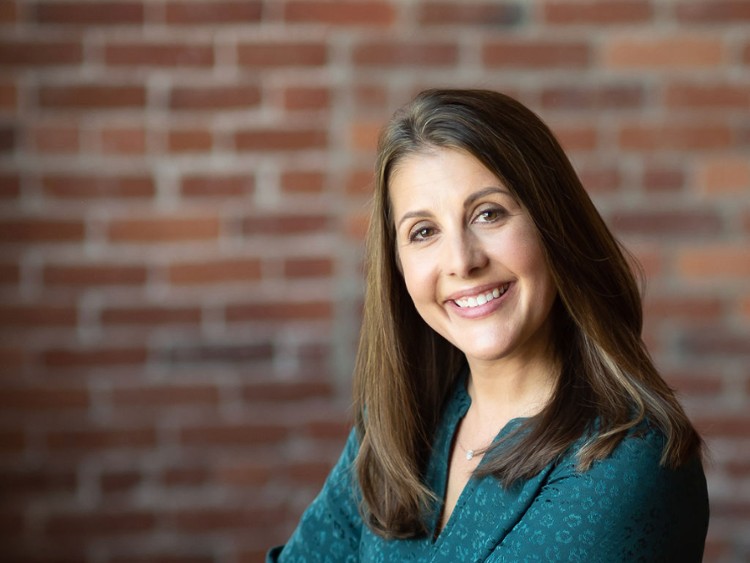 A headshot of Holly Redding Cooper.