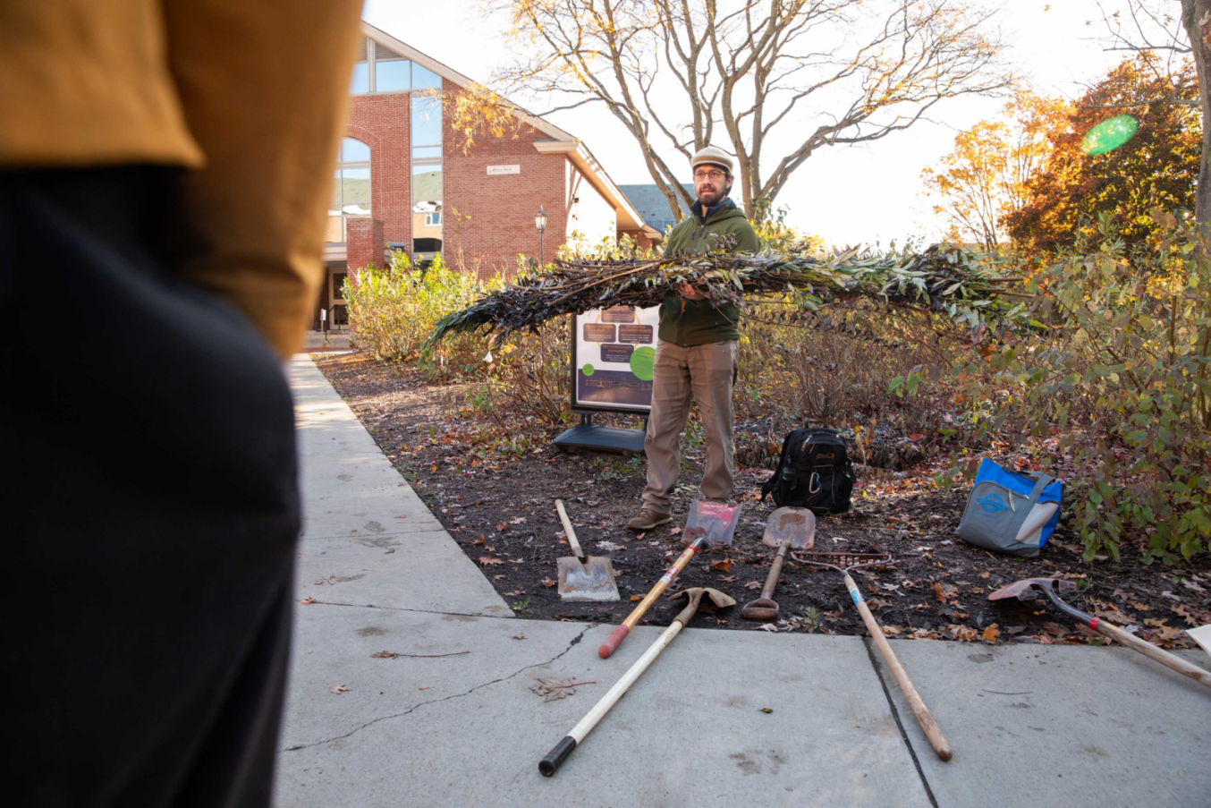 Professor Trevien Stanger harvests and demonstrates planting a willow fascine.