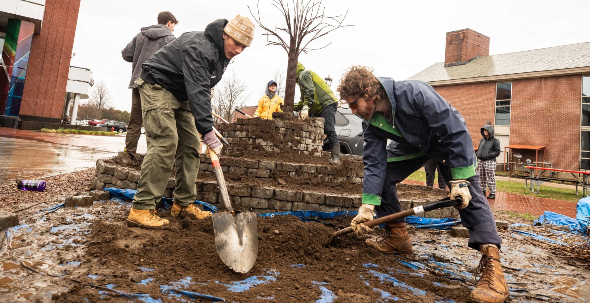 students digging dirt in the spiral garden