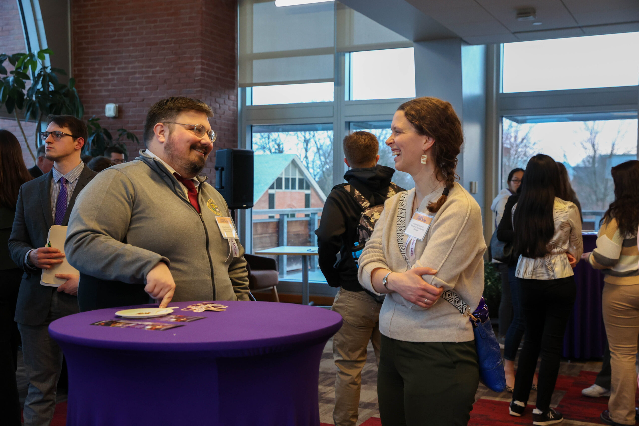 Alumni Richard Bernache '16 and Bridget McElroy '17 catch up at the Alumni Networking Reception.