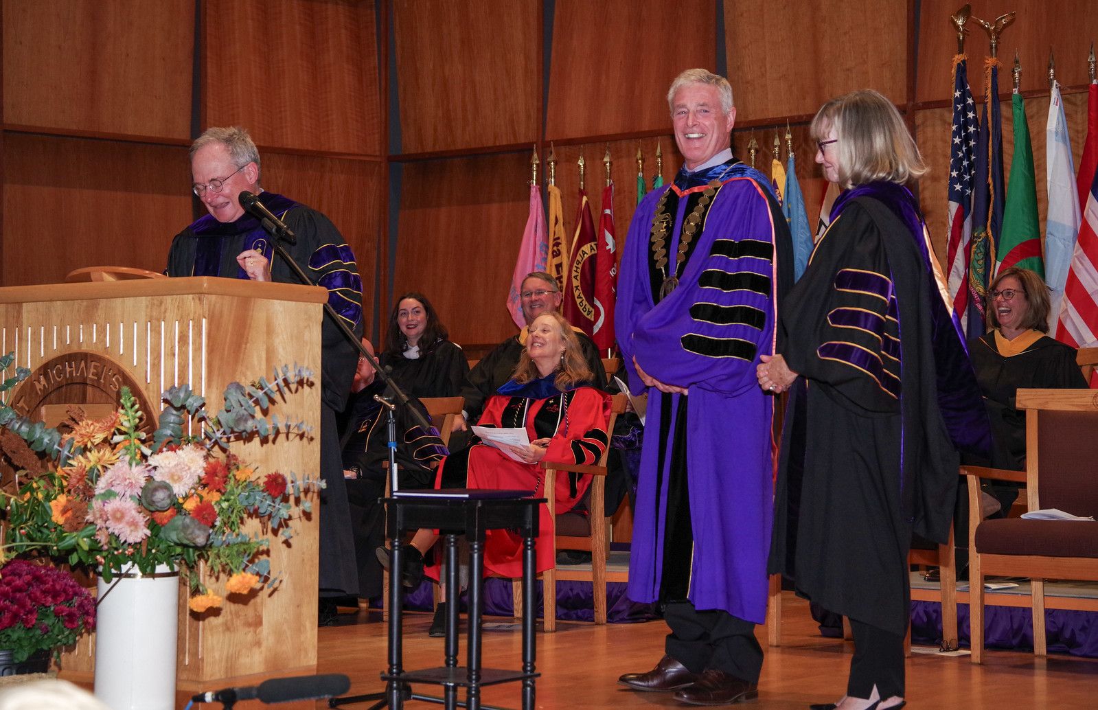 Saint Michael's College President Richard Plumb is officially bestowed the title of president by Board of Trustees Chair Rob Noonan, left, and former Chair Pat Casey during Plumb's Inauguration Ceremony on Oct. 26, 2024.